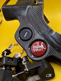 steering wheel suspension button